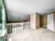 Bonus room with a railing and large window offering plenty of natural light and a spacious layout at 7211 Topp Creek Ct, Indianapolis, IN 46214