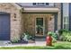 Inviting front entrance with brick surround and charming landscaped details at 7211 Topp Creek Ct, Indianapolis, IN 46214