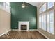 Spacious living room with fireplace, high ceilings, and large windows at 7211 Topp Creek Ct, Indianapolis, IN 46214