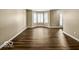 Open living space with hardwood floors, bay window, and plenty of natural light at 7211 Topp Creek Ct, Indianapolis, IN 46214