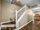 Traditional staircase with wooden treads and white railings at 7211 Topp Creek Ct, Indianapolis, IN 46214