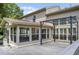 A well-lit sunroom adjacent to a spacious deck with a pergola, offering a perfect transition to outdoor enjoyment at 7211 Topp Creek Ct, Indianapolis, IN 46214