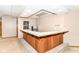 Finished basement featuring a bar area with ample counter space and a mini fridge for entertaining at 7220 Normandy Way, Indianapolis, IN 46278