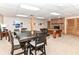 Spacious finished basement with a dining table, pool table, and brick fireplace, perfect for recreation at 7220 Normandy Way, Indianapolis, IN 46278