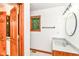 Bathroom featuring a vanity with solid surface counters, wood framed window and tiled floors at 7220 Normandy Way, Indianapolis, IN 46278