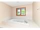 Relaxing bathtub with jets and a garden window at 7220 Normandy Way, Indianapolis, IN 46278
