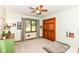 The carpeted bedroom has ample natural light and closet space, complete with a ceiling fan for comfort at 7220 Normandy Way, Indianapolis, IN 46278