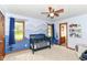 This Bedroom features blue walls with painted mountain scenes and a closet with wood doors at 7220 Normandy Way, Indianapolis, IN 46278