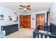 This Bedroom features a dark wood closet and crib and a changing table in a carpeted room at 7220 Normandy Way, Indianapolis, IN 46278