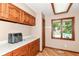 Well-appointed laundry room adjacent to pool with outside view at 7220 Normandy Way, Indianapolis, IN 46278