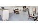 Finished basement with painted floors, dark wood trim and an adjacent open space at 749 Bracknell Dr, Avon, IN 46123