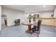 Basement features a table, chairs, and kitchenette area with a stainless steel refrigerator at 749 Bracknell Dr, Avon, IN 46123