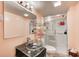 Bathroom with a modern glass sink, mirror, and a glass door shower at 749 Bracknell Dr, Avon, IN 46123