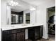 Dual sink bathroom vanity with great lighting and a glimpse into the shower and bedroom at 749 Bracknell Dr, Avon, IN 46123