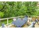 Deck featuring outdoor furniture and a grill overlooking lush green trees at 749 Bracknell Dr, Avon, IN 46123