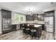 Beautiful kitchen features dark wood cabinets, stainless steel appliances, and a large center island at 749 Bracknell Dr, Avon, IN 46123