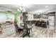 Modern kitchen with dark cabinets, stainless steel appliances, granite counters, and breakfast bar at 749 Bracknell Dr, Avon, IN 46123