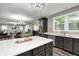 Open concept kitchen with an island and a view into the living room at 749 Bracknell Dr, Avon, IN 46123