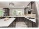Modern kitchen with dark wood cabinetry, granite countertops and stainless steel appliances at 749 Bracknell Dr, Avon, IN 46123