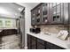 Galley style kitchen with stainless steel appliances and dark wood cabinetry at 749 Bracknell Dr, Avon, IN 46123