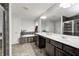 The main bathroom includes double sinks, a soaking tub, a shower, and stylish gray tile at 749 Bracknell Dr, Avon, IN 46123