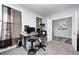 Comfortable office with neutral carpet, gray walls, bright window, and computer desk at 749 Bracknell Dr, Avon, IN 46123