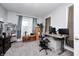 Comfortable office with neutral carpet, gray walls, bright window, and computer desk at 749 Bracknell Dr, Avon, IN 46123