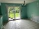 Dining room featuring tile flooring and sliding glass doors leading to the backyard at 8045 Briarwood Dr, Indianapolis, IN 46227