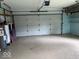 Spacious two-car garage with shelves and ample room for storage at 8045 Briarwood Dr, Indianapolis, IN 46227