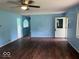 Open concept living room with hardwood floors and a doorway to another room at 8045 Briarwood Dr, Indianapolis, IN 46227