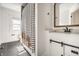 Updated bathroom featuring stylish vanity, decorative mirror, and sleek fixtures at 805 N Temple Ave, Indianapolis, IN 46201