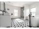Elegant bathroom with patterned tile floors, a modern sink, and a glass-enclosed shower at 805 N Temple Ave, Indianapolis, IN 46201