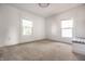 Bright bedroom featuring neutral carpet, white walls, and two windows at 805 N Temple Ave, Indianapolis, IN 46201