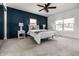 Comfortable bedroom with ample natural light, a decorative paneled wall, and neutral decor at 805 N Temple Ave, Indianapolis, IN 46201