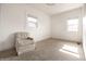 Sun-filled bedroom featuring neutral carpet and white walls at 805 N Temple Ave, Indianapolis, IN 46201