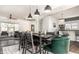 Bright dining area with a modern table, elegant chairs, and an open view into the living room and kitchen at 805 N Temple Ave, Indianapolis, IN 46201