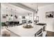 Open-concept kitchen with quartz counters, stainless appliances, and dining area beyond the island at 805 N Temple Ave, Indianapolis, IN 46201