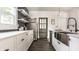 Bright kitchen showcasing stainless steel appliances, a farmhouse sink, and elegant white cabinetry at 805 N Temple Ave, Indianapolis, IN 46201