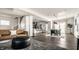 Open-concept living and dining area featuring a modern kitchen, stylish furniture, and plenty of natural light at 805 N Temple Ave, Indianapolis, IN 46201