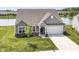 Aerial view of a lovely home with an attached garage in a neighborhood on a pond at 8263 Bryce Blvd, Pendleton, IN 46064
