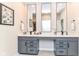 Elegant bathroom with double vanity, gray cabinets, quartz countertop and modern fixtures at 8263 Bryce Blvd, Pendleton, IN 46064