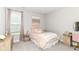 Cozy bedroom with soft pink decor, plush bedding, and coordinated furniture set at 8263 Bryce Blvd, Pendleton, IN 46064