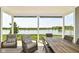 Enjoy relaxing views of the lake from this covered patio with comfortable seating and outdoor dining space at 8263 Bryce Blvd, Pendleton, IN 46064