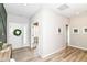 Inviting foyer with wood floors and a white front door decorated with a green wreath at 8263 Bryce Blvd, Pendleton, IN 46064