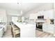 Modern kitchen features large island with seating, stainless steel appliances, and bright white cabinets at 8263 Bryce Blvd, Pendleton, IN 46064