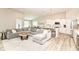 Open-concept living room flows into the kitchen, featuring a large sectional sofa at 8263 Bryce Blvd, Pendleton, IN 46064