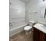 Bathroom with shower-tub combo and single sink vanity with wood cabinet at 832 Spinney Ln, Whiteland, IN 46184