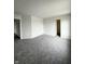 Spacious bedroom with neutral paint, carpet and doors leading to closets at 832 Spinney Ln, Whiteland, IN 46184