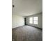 Spacious carpeted bedroom with neutral paint, large closet door, and double window at 832 Spinney Ln, Whiteland, IN 46184