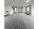 Large upstairs bonus room featuring gray carpet, neutral paint, with a stairway railing at 832 Spinney Ln, Whiteland, IN 46184
